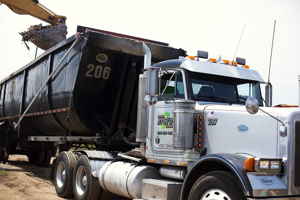 A DWT tractor and dump trailer being loaded