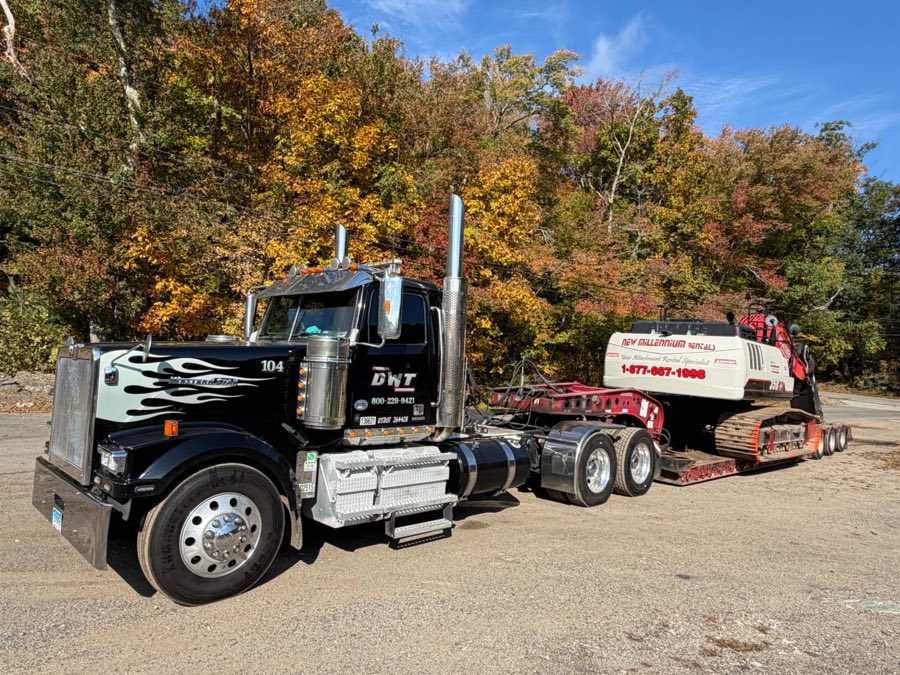 Unit 104 hauling a tracked excavator on the low bed